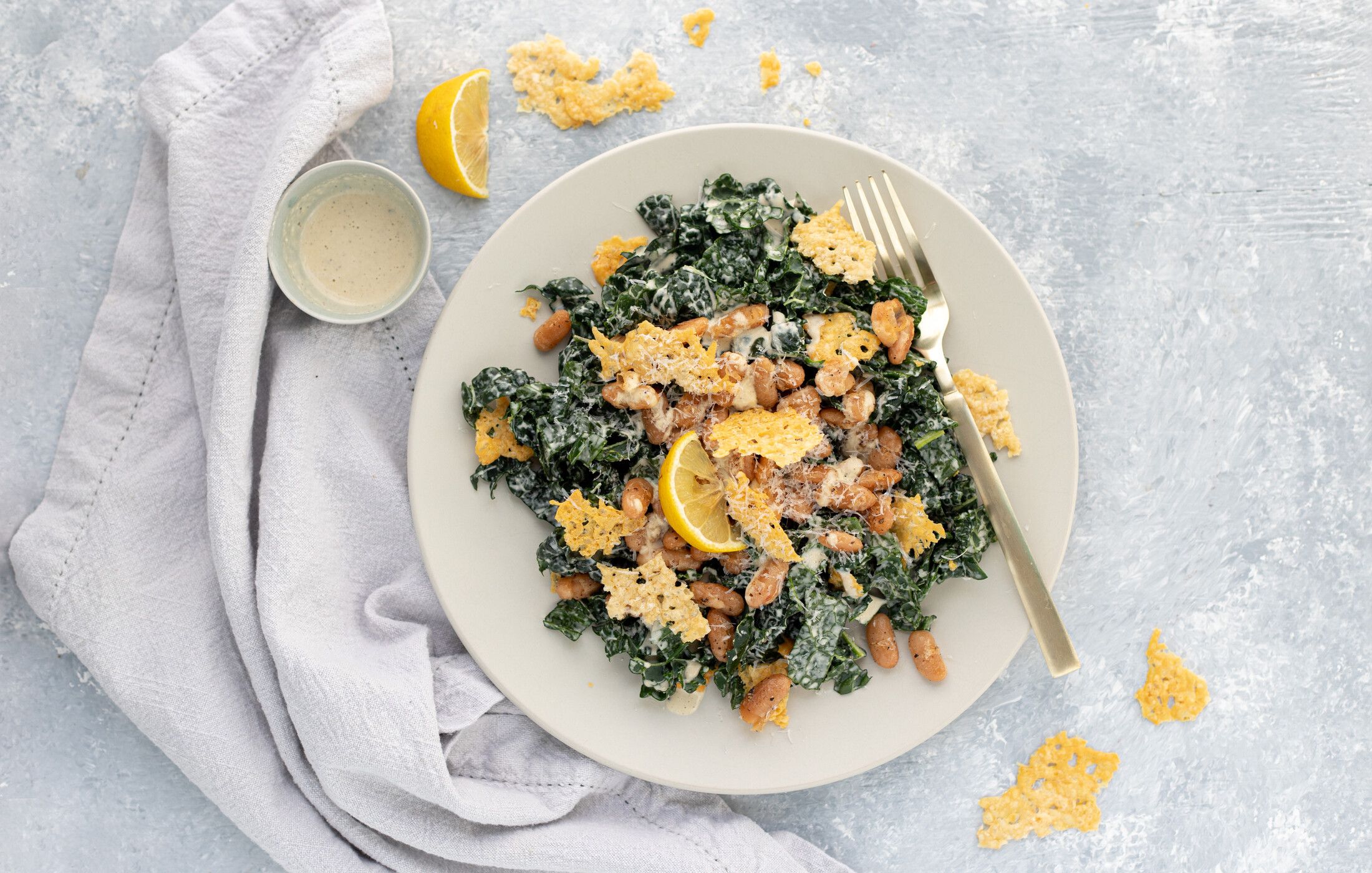 Kale Caesar Salad with Cannellini Beans and Parmesan Crisps 